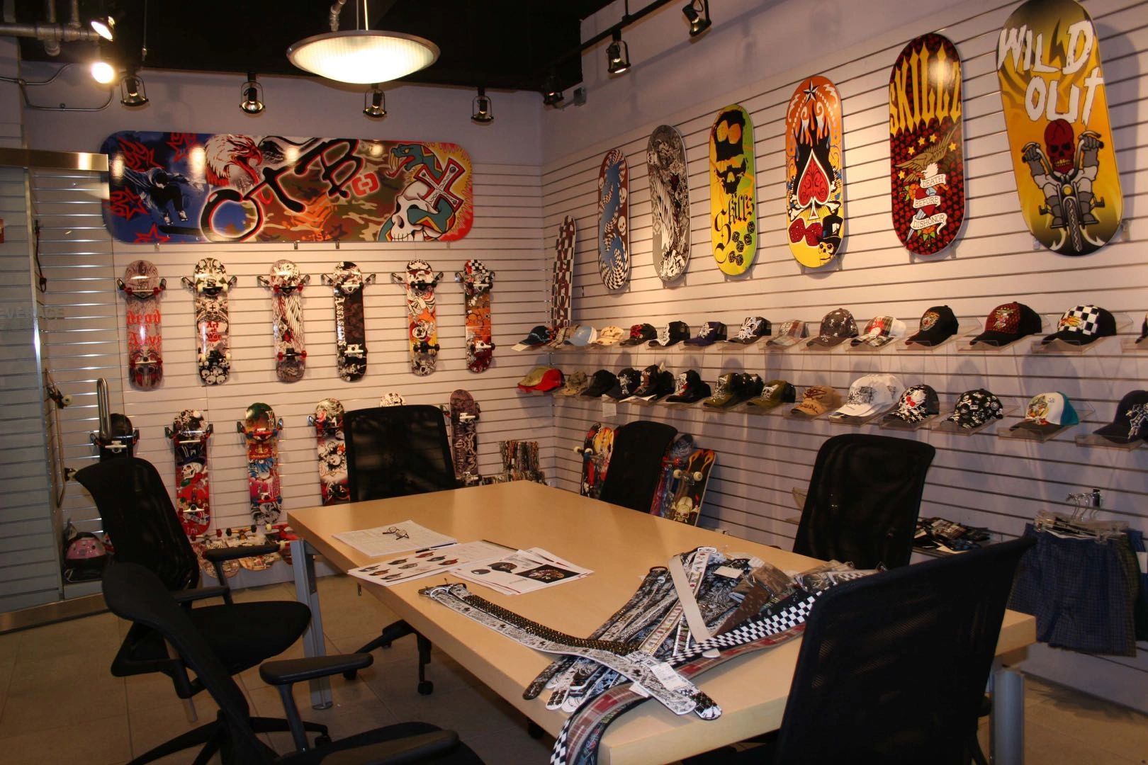 Archival OTB skate decks and caps displayed in a showroom